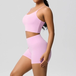 Detail of pink yoga set with U-neck camisole and high-waist slim fitness shorts