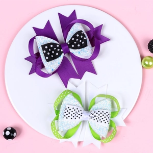 Handmade Halloween layered hair bows for girls in purple and green with polka dots