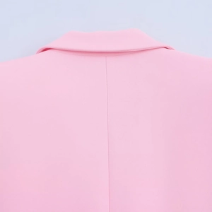 Detail shot of the collar and back stitching on the pink blazer jacket suit