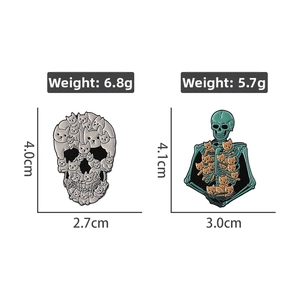 Detail view of skeleton cat enamel pins with dimensions and weight measurements
