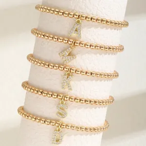 Elegant gold beaded bracelets with rhinestone initial letter pendants for women