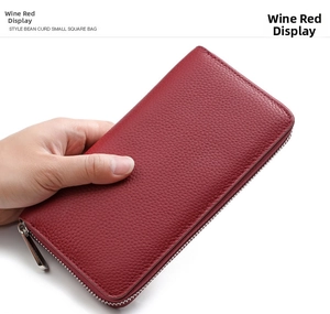 Detail view of wine red genuine leather wallet with lychee pattern and silver zipper