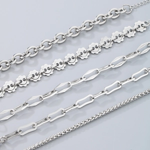 Detail of four distinct stainless steel chain styles in a sleek silver finish for women