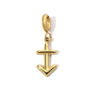 Close-up of golden anchor cross pendant with stainless steel ring for jewelry DIY