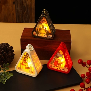 Three vintage Christmas lanterns in bronze, white and red with LED lights and festive patterns