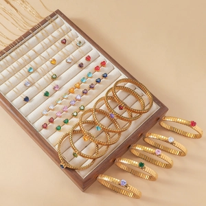 Close-up of heart-shaped multi-color gemstone jewelry set with necklace and bracelets