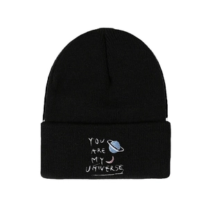 Black knit beanie featuring You are my universe embroidery and cosmic planet patterns