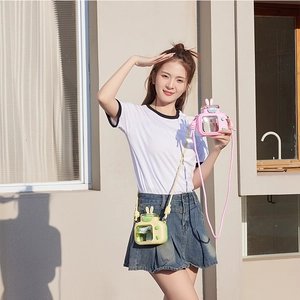 Detail of creative TV-shaped children straw water bottle with adjustable carry strap