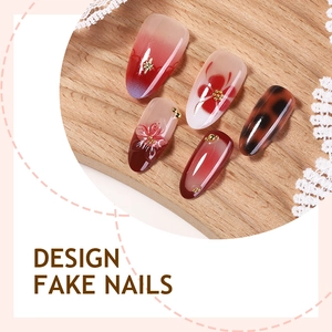 French almond fake nails with 3D flowers, golden beads and leopard pattern design