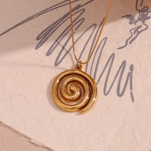 Detailed close-up of 18K gold plated spiral swirl pendant on a sleek snake chain necklace