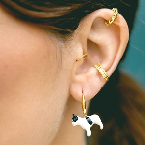 Detailed view of 18k gold plated C-shaped ear cuffs featuring a French Bulldog charm and zircons