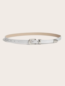 Detail of white slim leather belt showing the silver metal buckle and modern tip