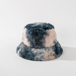 Close-up of soft plush tie-dye bucket hat in blue and pink tones with fuzzy texture