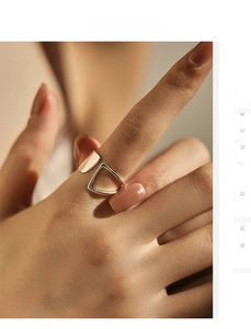 Close-up of minimalist S925 sterling silver hollow geometric open ring on finger