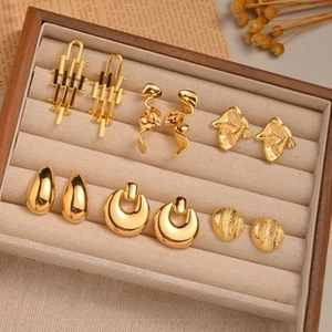 Detailed close-up of a 6-pair vintage gold earring set in a premium velvet display box