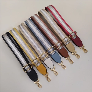 Detailed display of colorful striped replacement shoulder straps with gold metal hooks