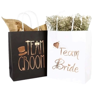 Elegant gold foil wedding gift bags for Team Bride and Team Groom in white and black
