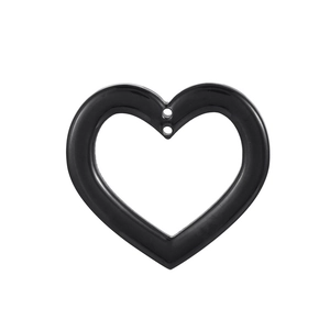 Macro detail of a black heart pendant with double holes in minimalist stainless steel design