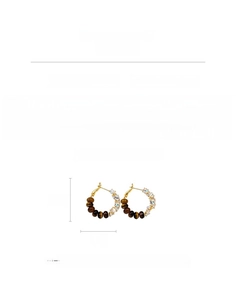 Detail view of gold hoop earrings with zircon and tiger eye beads, 3cm height