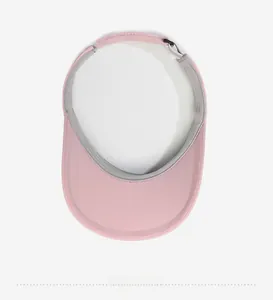 Detail view of pink sun visor interior showing grey sweatband and adjustable buckle strap