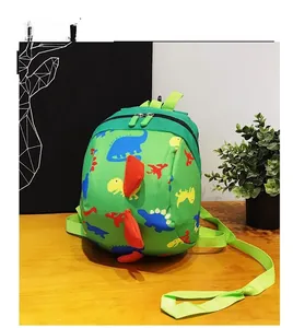 Detail of green dinosaur backpack with orange spikes on a warm wooden surface
