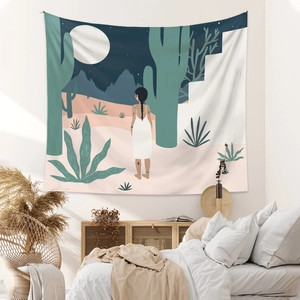 Bohemian wall tapestry showing a woman in desert moonlight above a minimalist bedroom