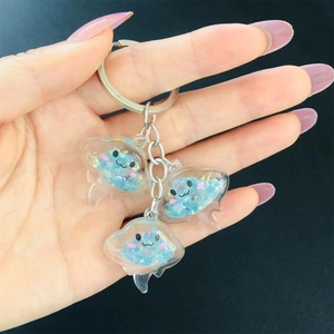 Luminous jellyfish resin keychain with colorful sequins and silver metal ring accessory