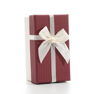 Rectangular burgundy bow gift box with lid and cream base featuring cross texture