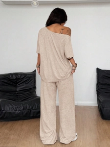 Detail showing the draped texture and wide-leg cut of the khaki casual two-piece knit set