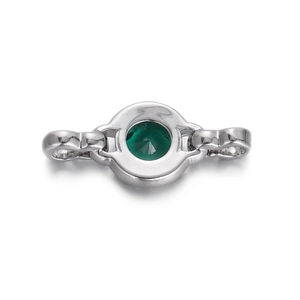 Macro shot of silver connector with round green gemstone for jewelry making