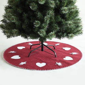Red Christmas tree skirt with plush gnome patterns and white hearts decoration