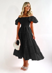 Detail of off-shoulder puff sleeves and tiered black midi dress with checkered texture
