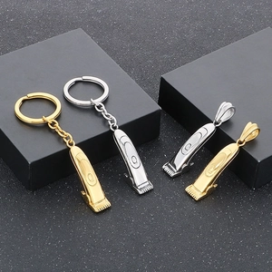 Detailed view of hip-hop style comb pendants and keychains in gold and silver finishes