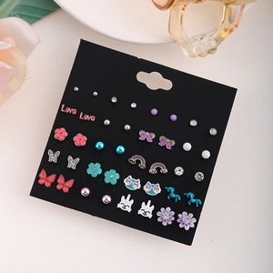 Multi-pack stud earring set with unicorn, butterfly, and pearl motifs on display card