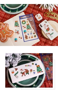 Close-up of cute Christmas PET stickers on phone cases and notebooks for holiday DIY decor