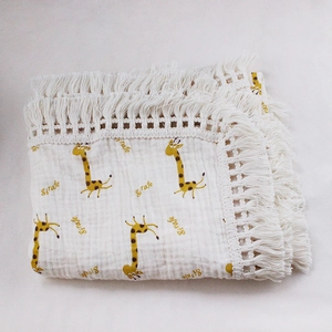 Soft double-layer cotton baby blanket with giraffe print and decorative tassel edges