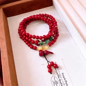 Elegant Chinese cinnabar red multi-layered bead bracelet with a lucky gourd pendant