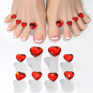 Detail view of 8 red heart rhinestone toe separators for Japanese nail art pedicure