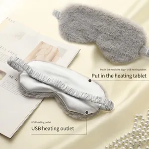 Gray plush USB heating eye mask with soft fur exterior and silk lining for sleep