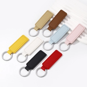 Set of 8 colorful faux leather car keychains with silver rings in various modern tones