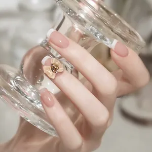 Elegant jelly nude pink press-on nails with 3D bow and brown drop gemstone accent