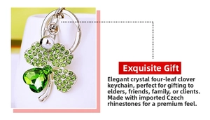 Detailed view of silver clover keychain with green crystals and sparkling rhinestones
