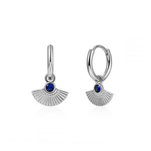 Detail of silver fan-shaped earrings with a dark blue crystal on a white background