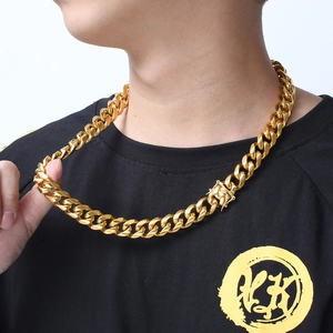 Hip hop gold titanium steel Cuban link chain necklace for men shown on a male model