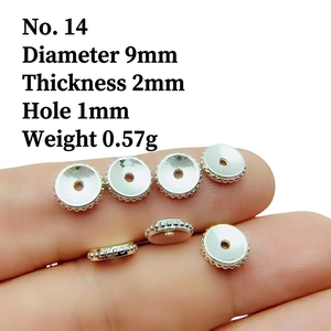 Detailed view of silver-plated alloy spacer beads with size specs on fingers