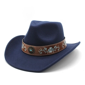 Navy blue wool cowboy hat featuring an embroidered leather band and blue gemstone stud