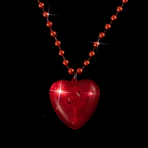 Glowing LED red heart pendant necklace with shimmering bead chain for Valentine's Day party.