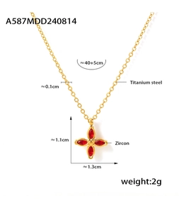 Detail showing red clover pendant size 1.1x1.3cm on 18k gold titanium necklace
