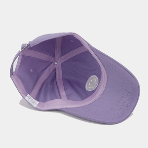 Inside view of purple cotton baseball cap featuring six-panel construction and metal buckle
