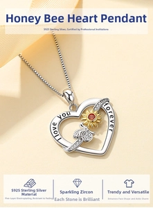 Detailed close-up of S925 silver heart pendant with golden bee and sunflower design